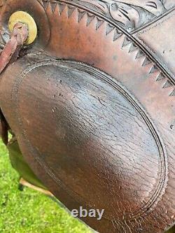 16 Antique A fork Western saddle withsteel horn, leather covered rigging