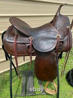 16 Antique A fork Western saddle withsteel horn, leather covered rigging