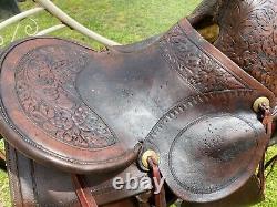 16 Antique A fork Western saddle withsteel horn, leather covered rigging