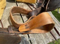 16 Antique A fork Western saddle withsteel horn, leather covered rigging