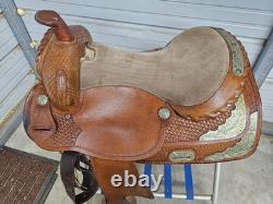 A Used 17 Brown Color Trail Saddle with Some Tooling and Silver