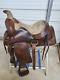 A Good Used 15 Brown Color Roping Saddle With Some Tooling