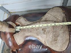 A good Used 15 Brown Color Roping Saddle with some tooling