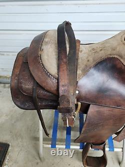 A good Used 15 Brown Color Roping Saddle with some tooling