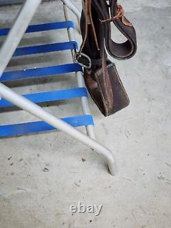 A good Used 15 Brown Color Roping Saddle with some tooling