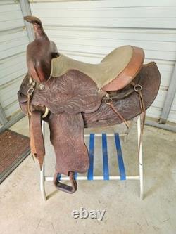 A good Used Brown Color 15 leather Trail saddle with Tooling
