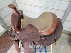 A good Used Brown Color 15 leather Trail saddle with Tooling