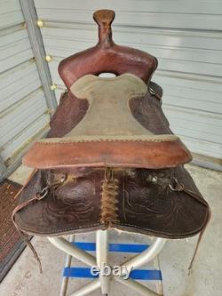 A good Used Brown Color 15 leather Trail saddle with Tooling