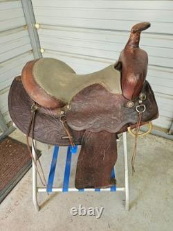 A good Used Brown Color 15 leather Trail saddle with Tooling