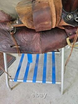 A good Used Brown Color 15 leather Trail saddle with Tooling
