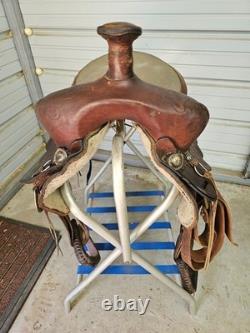 A good Used Brown Color 15 leather Trail saddle with Tooling