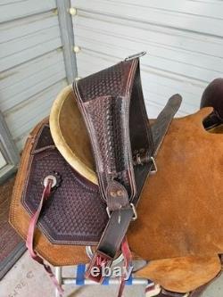 A used Brown color 16 Circle T Ranch Roper with Tooling