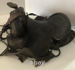 Antique Western Saddle With Stirrups and Rings