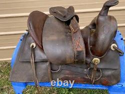 Antique/vintage R. T. Frazier 15.5 Western high back saddle with tapaderos