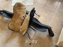 Antique/vintage ranch saddle. Restored to practical display or use