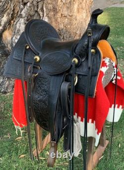 Antique western saddle, 1890 ca. Black, floral carved, 16 full seat A-fork