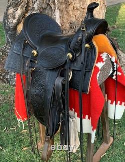 Antique western saddle, 1890 ca. Black, floral carved, 16 full seat A-fork