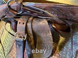 Identical pair of Vintage western trail saddles 14 inch tooled artwork