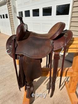 Slightly used 15 inch seat Clinton Anderson roughout western saddle by Martin