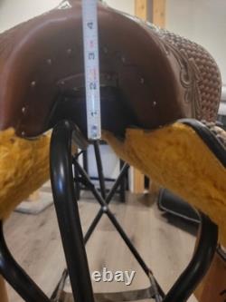 Super comfy leather Western trail saddle with stirrups included. Only ridden 3x