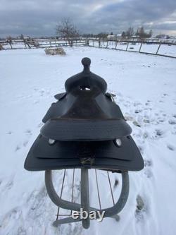 Used 12 black leather youth / pony western saddle withsuede seat