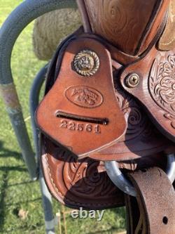 Used 13 Action Co. Tooled youth/child's western saddle withsuede seat US made