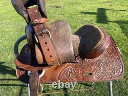 Used 13 Action Co. Tooled youth/child's western saddle withsuede seat US made