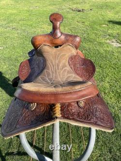 Used 13 Action Co. Tooled youth/child's western saddle withsuede seat US made
