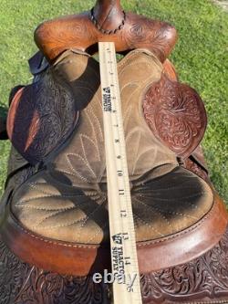 Used 13 Action Co. Tooled youth/child's western saddle withsuede seat US made