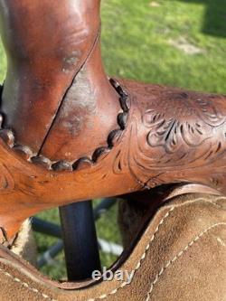 Used 13 Action Co. Tooled youth/child's western saddle withsuede seat US made