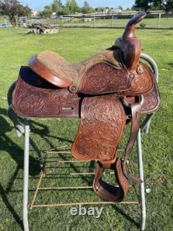 Used 13 Action Co. Tooled youth/child's western saddle withsuede seat US made