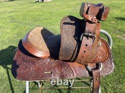Used 13 Action Co. Tooled youth/child's western saddle withsuede seat US made