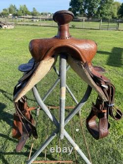 Used 13 Action Co. Tooled youth/child's western saddle withsuede seat US made