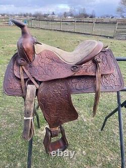 Used 13 brown tooled leather youth/child's western saddle withsuede seat US made