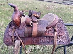 Used 13 brown tooled leather youth/child's western saddle withsuede seat US made