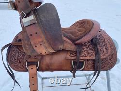 Used 13 brown tooled leather youth/child's western saddle withsuede seat US made