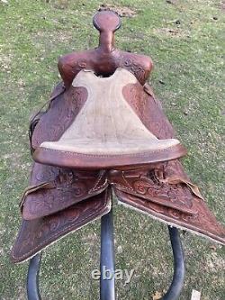 Used 13 brown tooled leather youth/child's western saddle withsuede seat US made