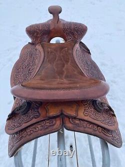 Used 13 brown tooled leather youth/child's western saddle withsuede seat US made