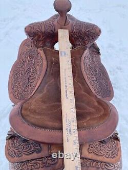 Used 13 brown tooled leather youth/child's western saddle withsuede seat US made