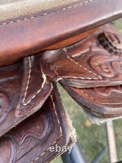 Used 13 brown tooled leather youth/child's western saddle withsuede seat US made