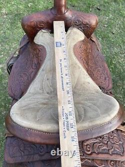 Used 13 brown tooled leather youth/child's western saddle withsuede seat US made