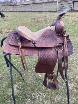 Used 13 brown tooled leather youth/child's western saddle withsuede seat US made