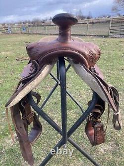 Used 13 brown tooled leather youth/child's western saddle withsuede seat US made