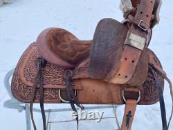 Used 13 brown tooled leather youth/child's western saddle withsuede seat US made