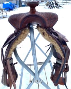 Used 13 brown tooled leather youth/child's western saddle withsuede seat US made