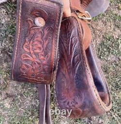 Used 13 brown tooled leather youth/child's western saddle withsuede seat US made