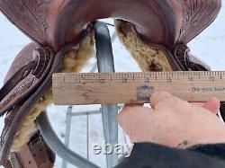 Used 13 brown tooled leather youth/child's western saddle withsuede seat US made