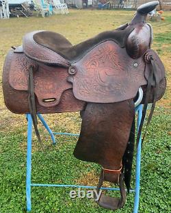 Used 15 Western saddle withtooled horse heads US made