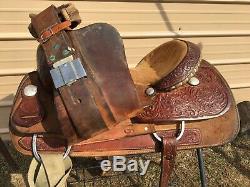 Used 16 Billy Cook Western roping saddle withtooled skirts, rough out fenders