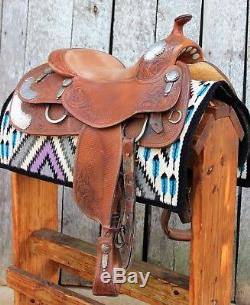 Used- Bob's 16 reining saddle with padded seat and hand engraved silver